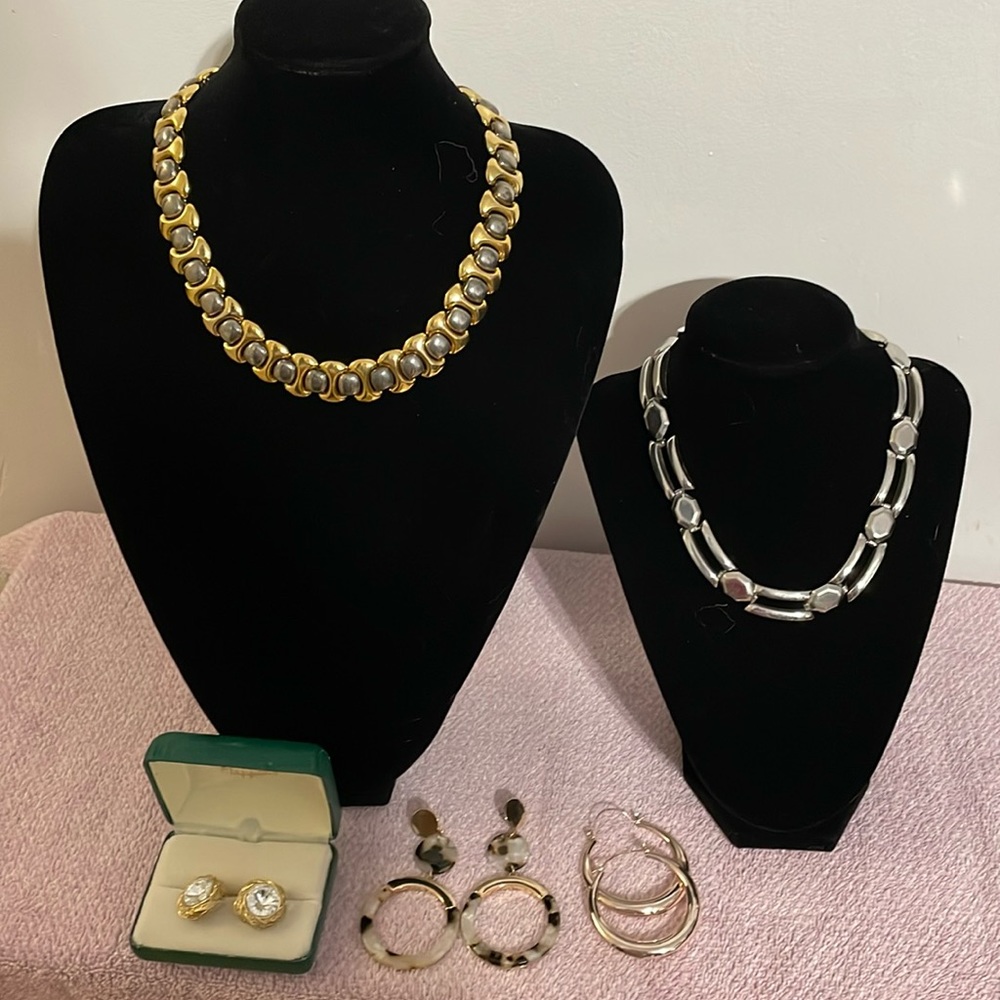 An assortment of vintage costume necklaces and earrings.